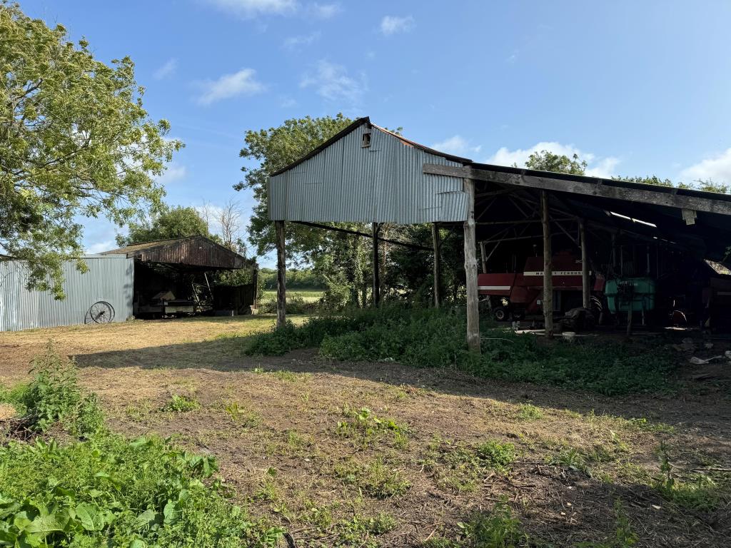 Lot: 130 - FREEHOLD RURAL BARN WITH CONSENT FOR CONVERSION ON A PLOT OF 1.27 ACRES - A Look Across the Site Showing Both Existing Barns